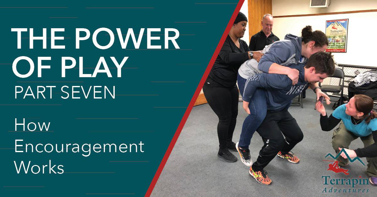 Blog header reads "The Power of Play Part Seven: How Encouragement Works." Pictured is a woman riding on a man's shoulders as two people assist.